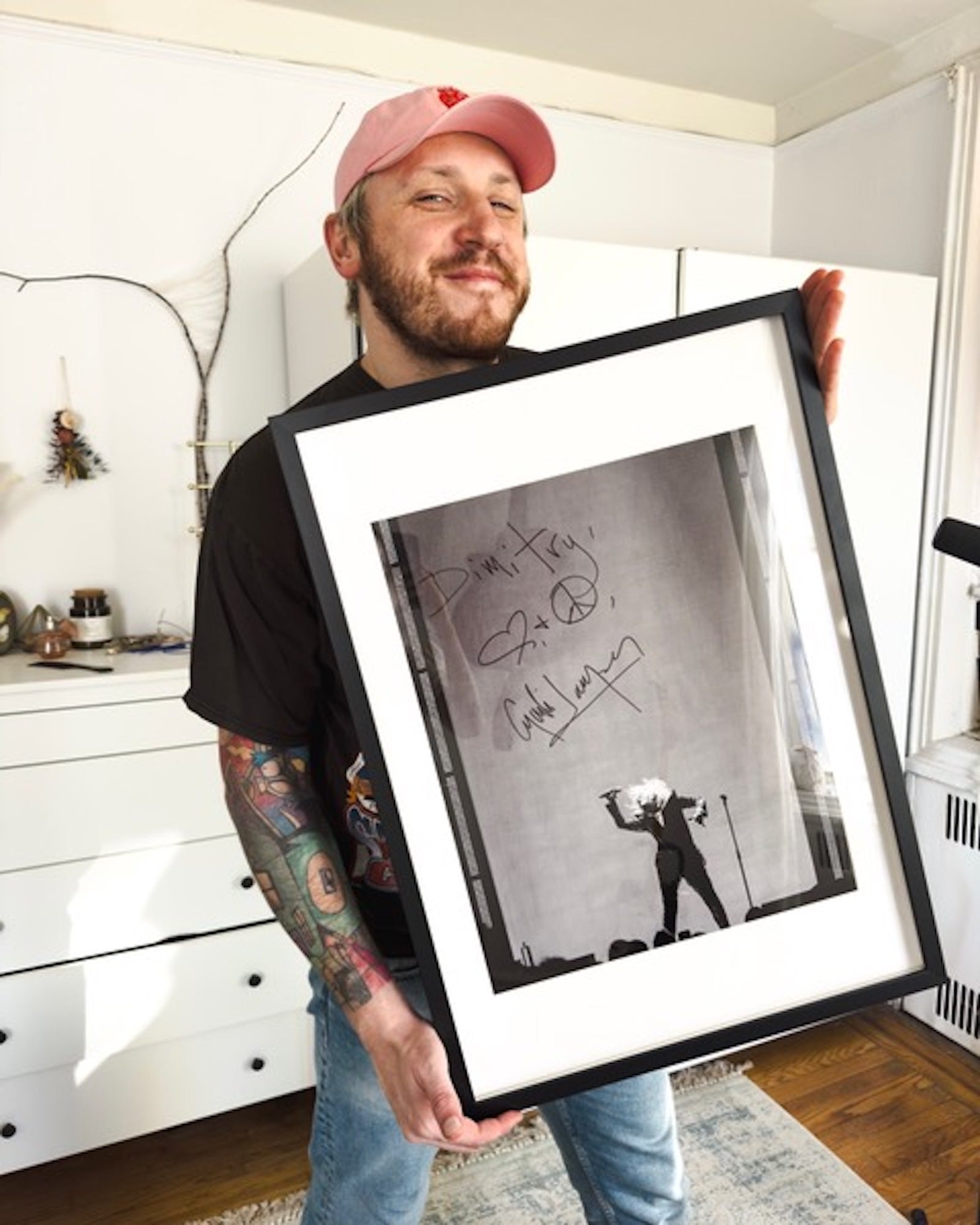 Photographer Dimitry Mak with his signed photo of Cyndi Lauper Photographer Dimitry Mak with his signed photo of Cyndi Lauper