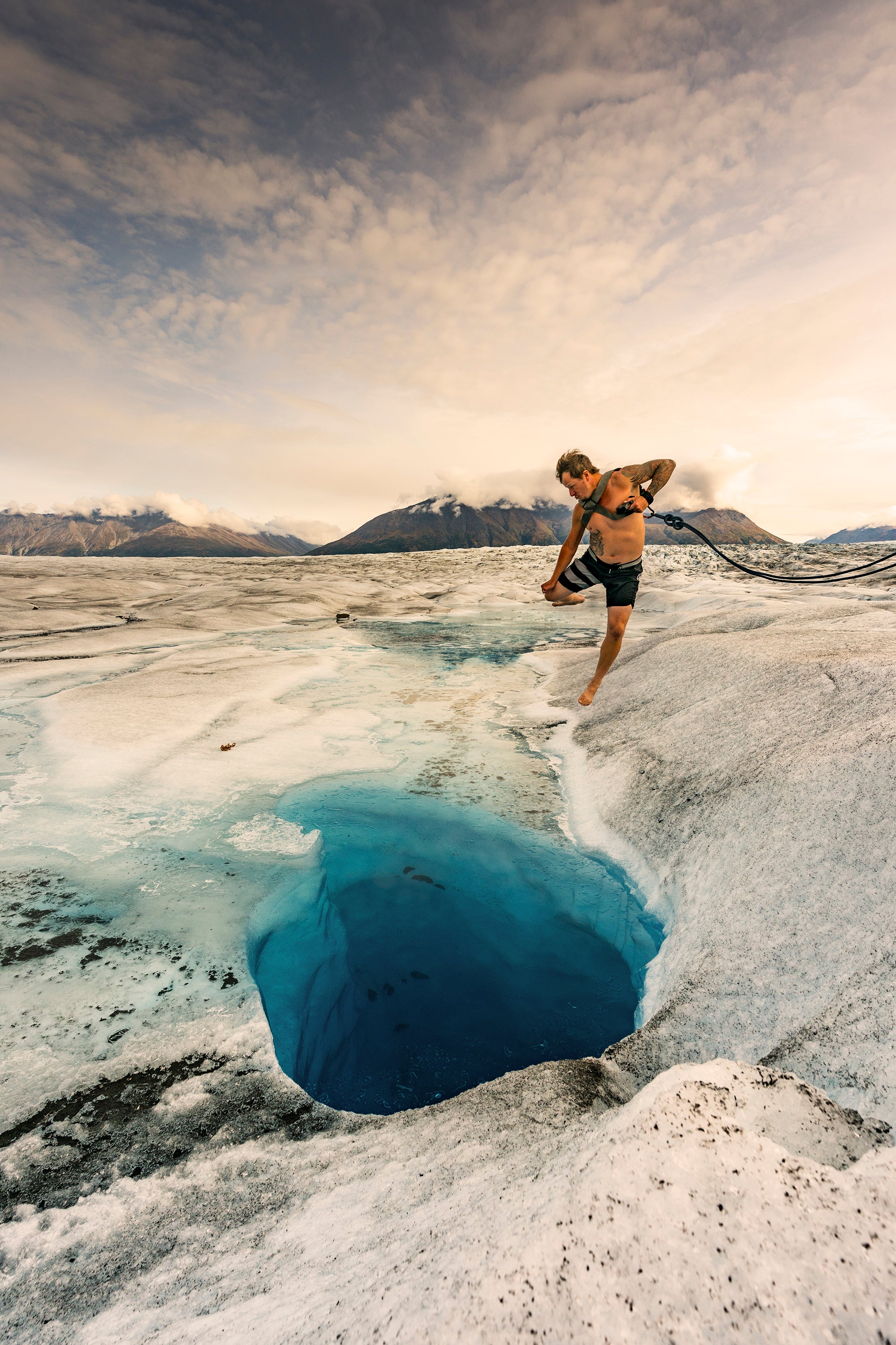 Me-jumping-into-glacier-pool-shot-with-Sony-a9---Gmaster-16-35mm-shutter-1000-f7.1-ISO-400-color-balance-sunny.jpg