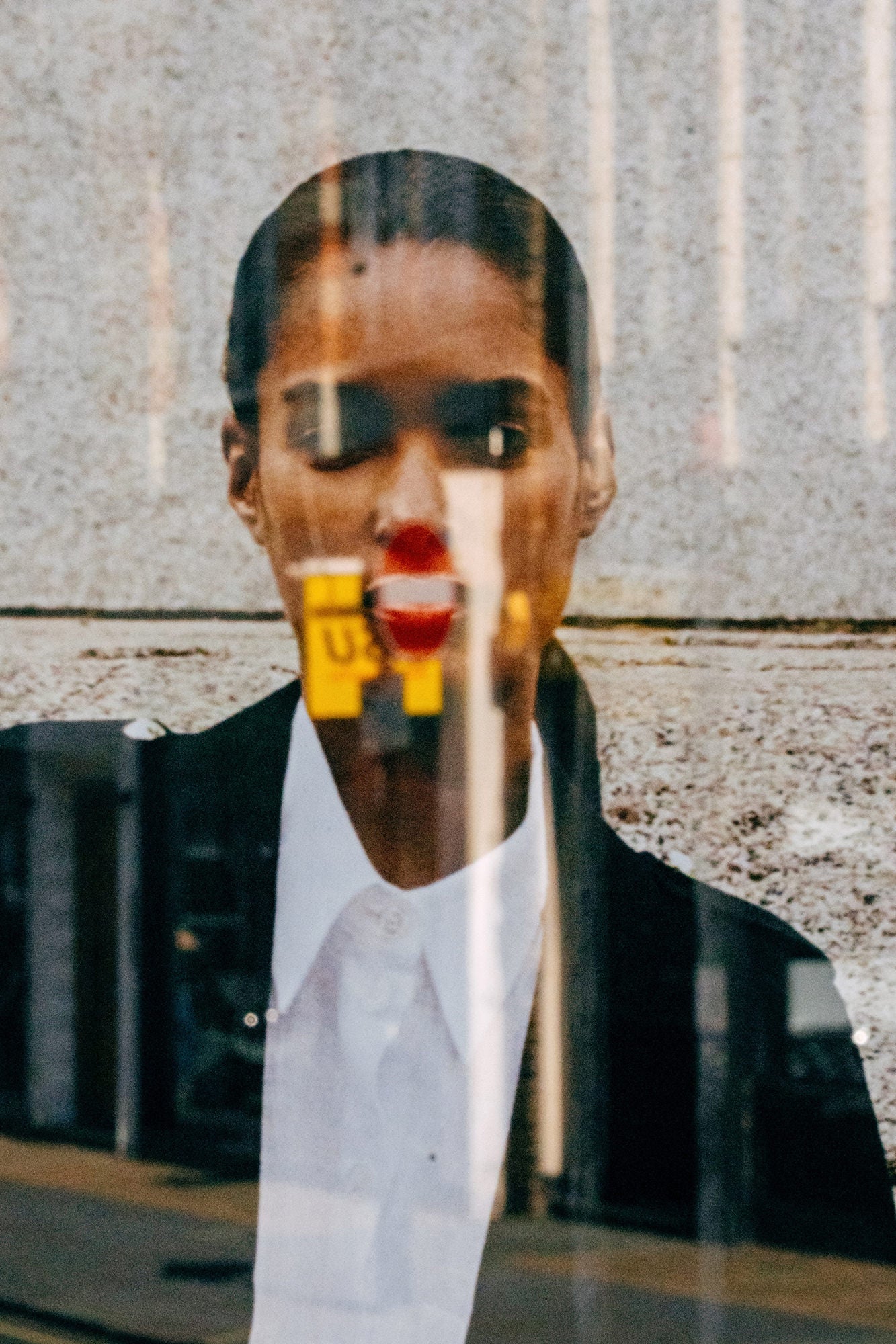 Abstract window reflection portrait with bold red lips in urban light, captured on Sony Alpha. Abstract window reflection portrait with bold red lips in urban light, captured on Sony Alpha.